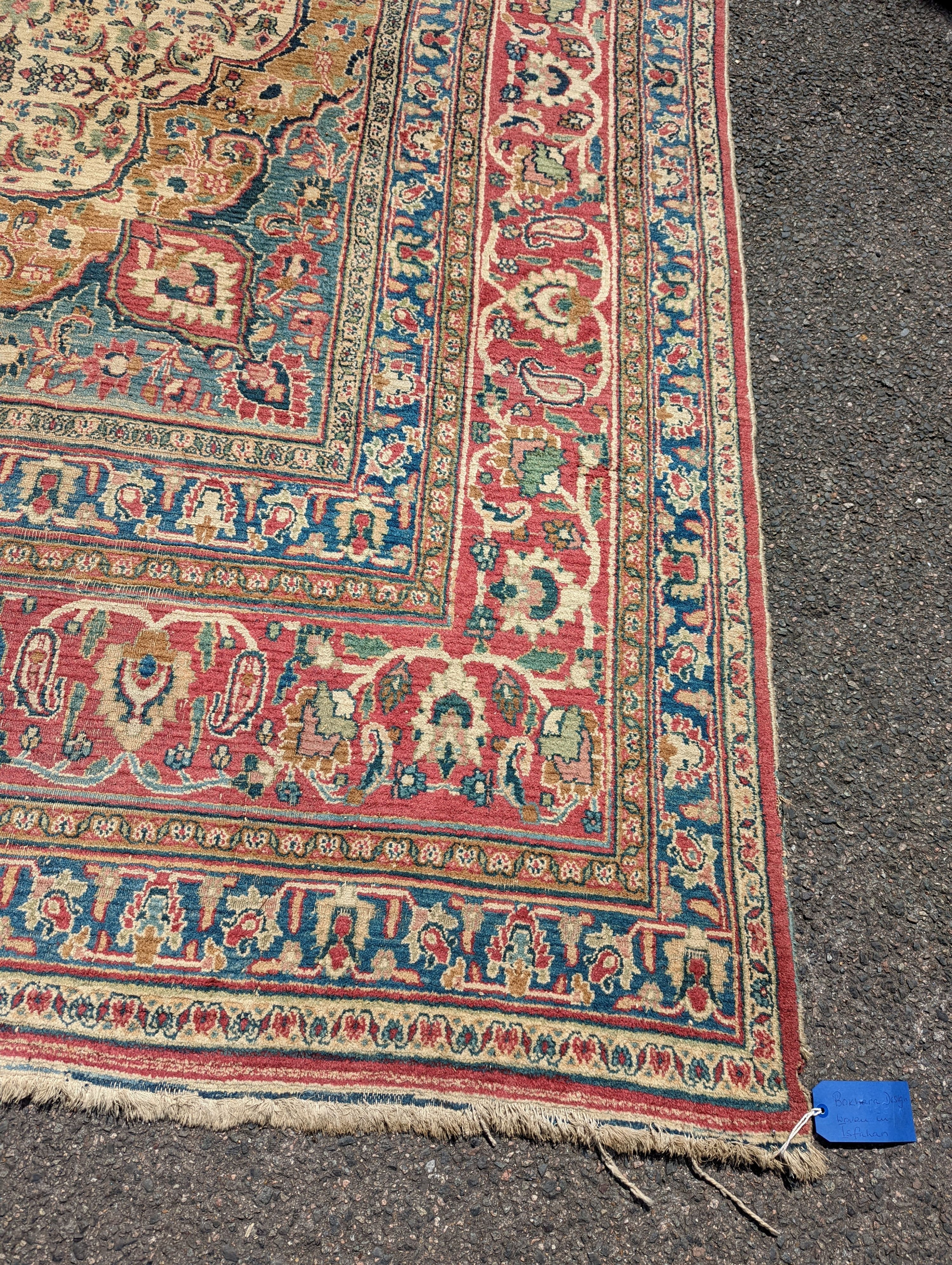 An Isfahan ivory ground carpet, 432 x 330cm